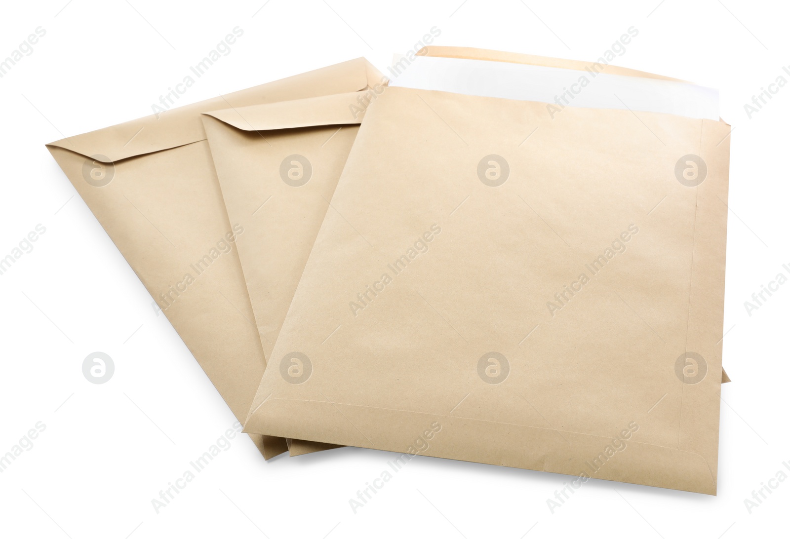 Photo of Many kraft paper envelopes on white background