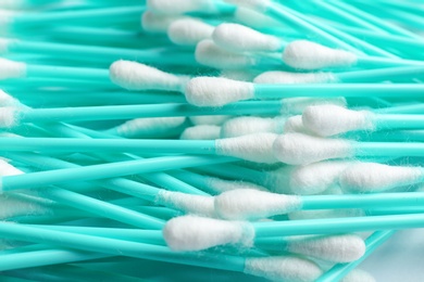 Photo of Pile of cotton swabs as background, closeup