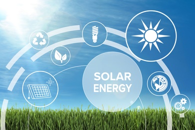 Image of Solar energy concept. Scheme with icons and sky over green grass on background