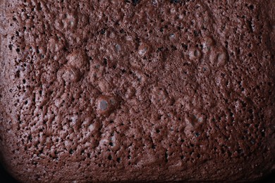 Texture of tasty chocolate sponge cake as background, top view