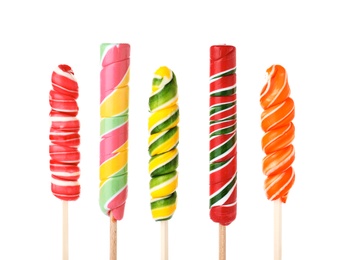 Different tasty colorful candies on white background