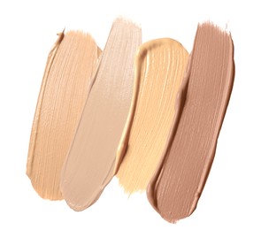 Image of Foundation of various shades for different skin tones isolated on white, top view. Set of samples