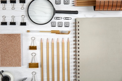 Different school stationery on wooden background, flat lay