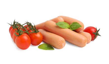 Delicious boiled sausages, tomatoes and basil on white background