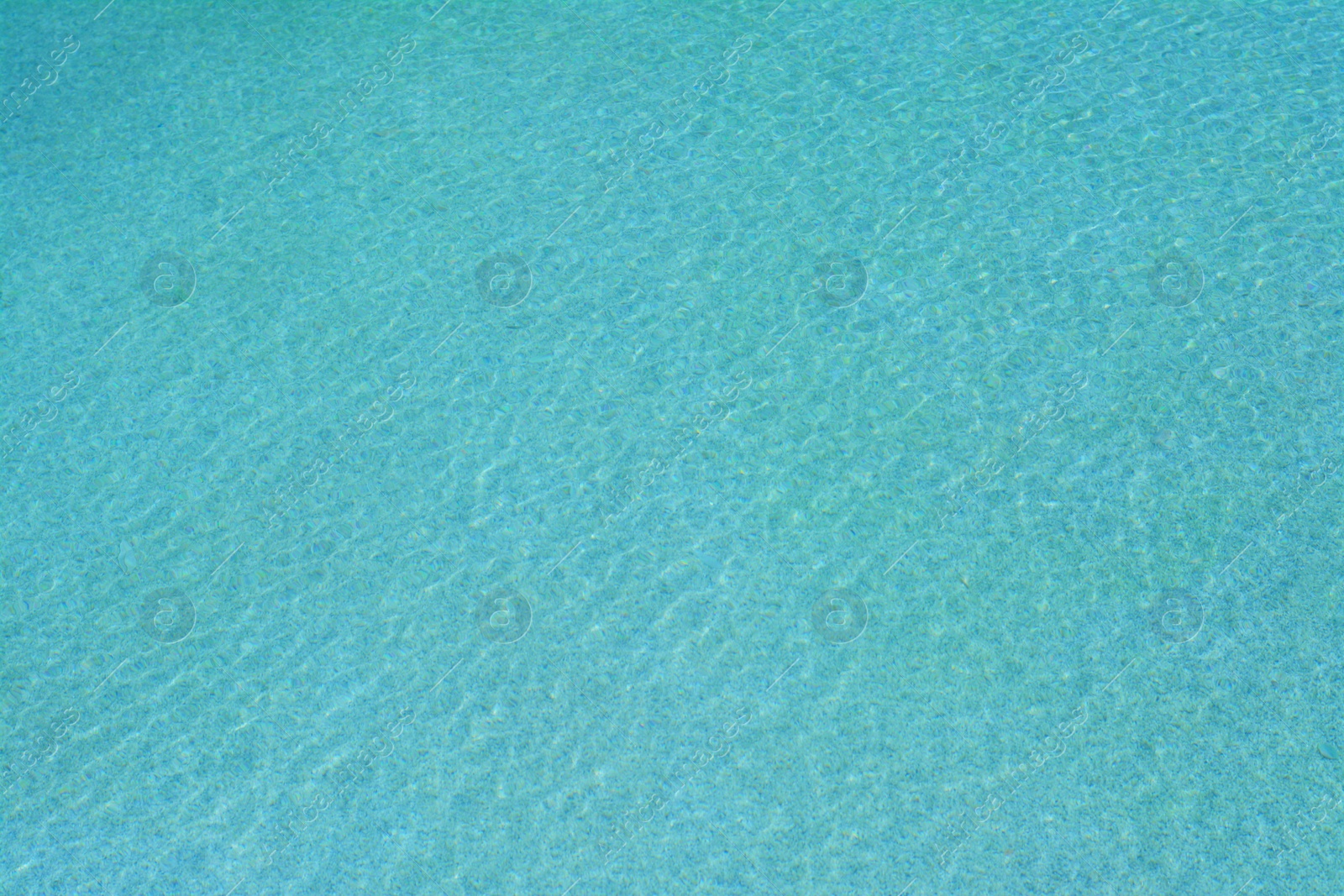 Photo of Calm clear water in swimming pool outdoors