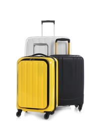 Modern suitcases for travelling on white background