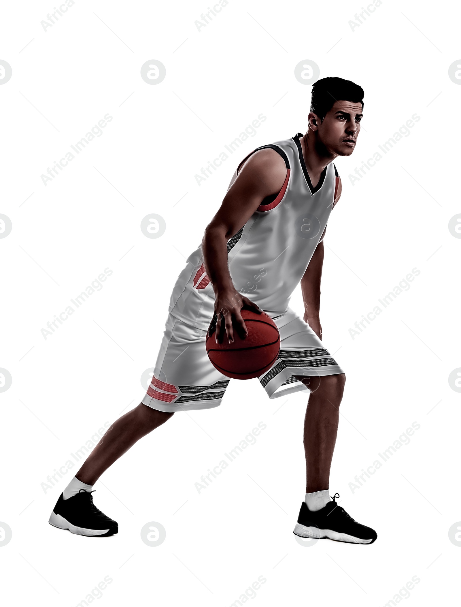 Image of Silhouette of professional sportsman playing basketball on white background