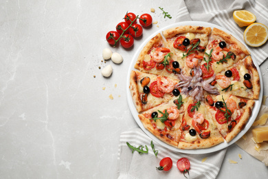 Photo of Tasty pizza with seafood and ingredients on light grey marble table, flat lay. Space for text