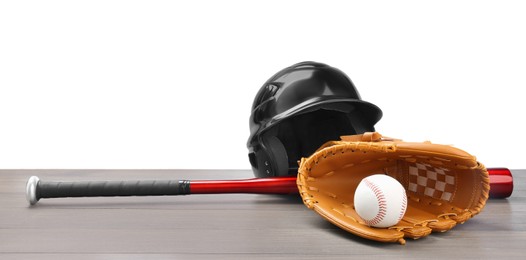 Photo of Baseball glove, bat, ball and batting helmet on light grey wooden table against white background