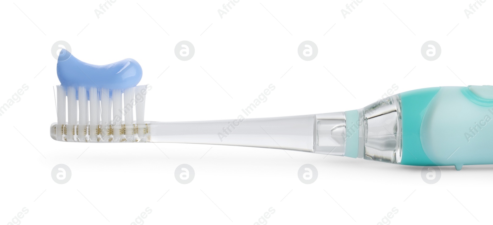 Photo of Electric toothbrush with paste on white background, closeup