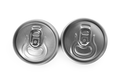 Photo of Top view of aluminum cans with beverage on white background