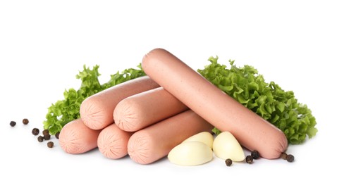 Photo of Raw vegetarian sausages with garlic and lettuce on white background