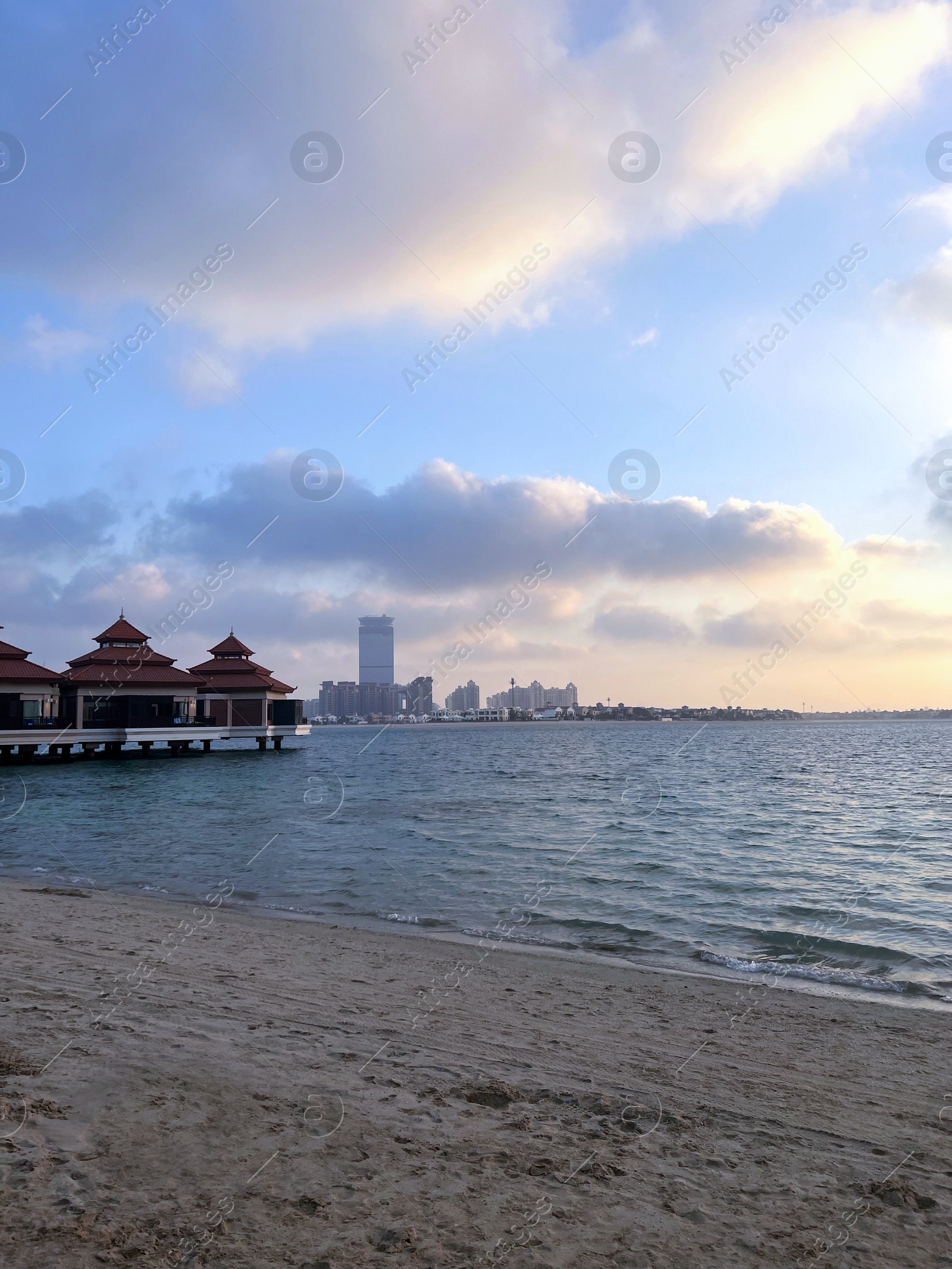 Photo of Beautiful view of sea and resort at sunset