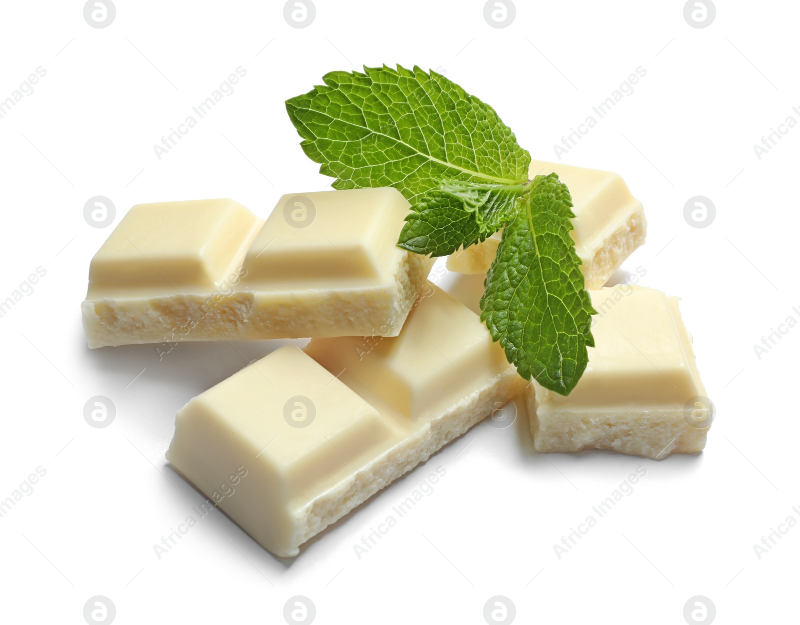 Photo of Pieces of white chocolate with mint on white background