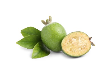 Whole and cut feijoa fruits on white background