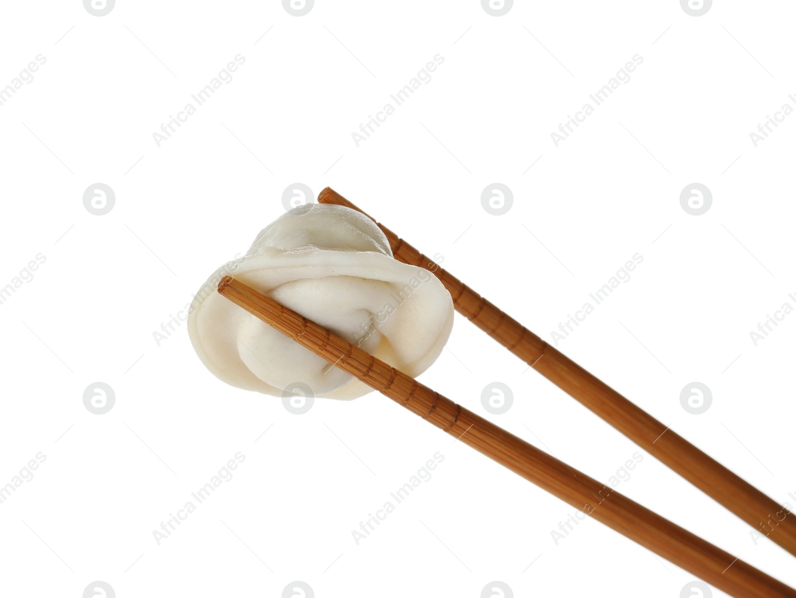 Photo of Chopsticks with tasty dumpling isolated on white