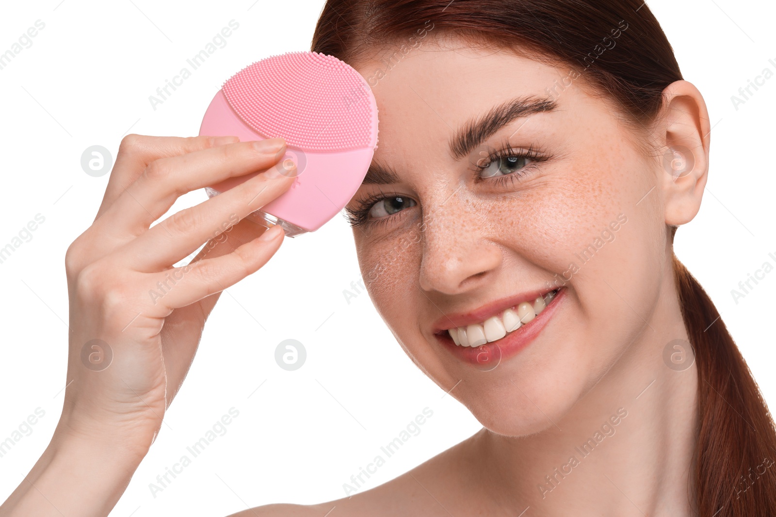 Photo of Washing face. Young woman with cleansing brush on white background, closeup