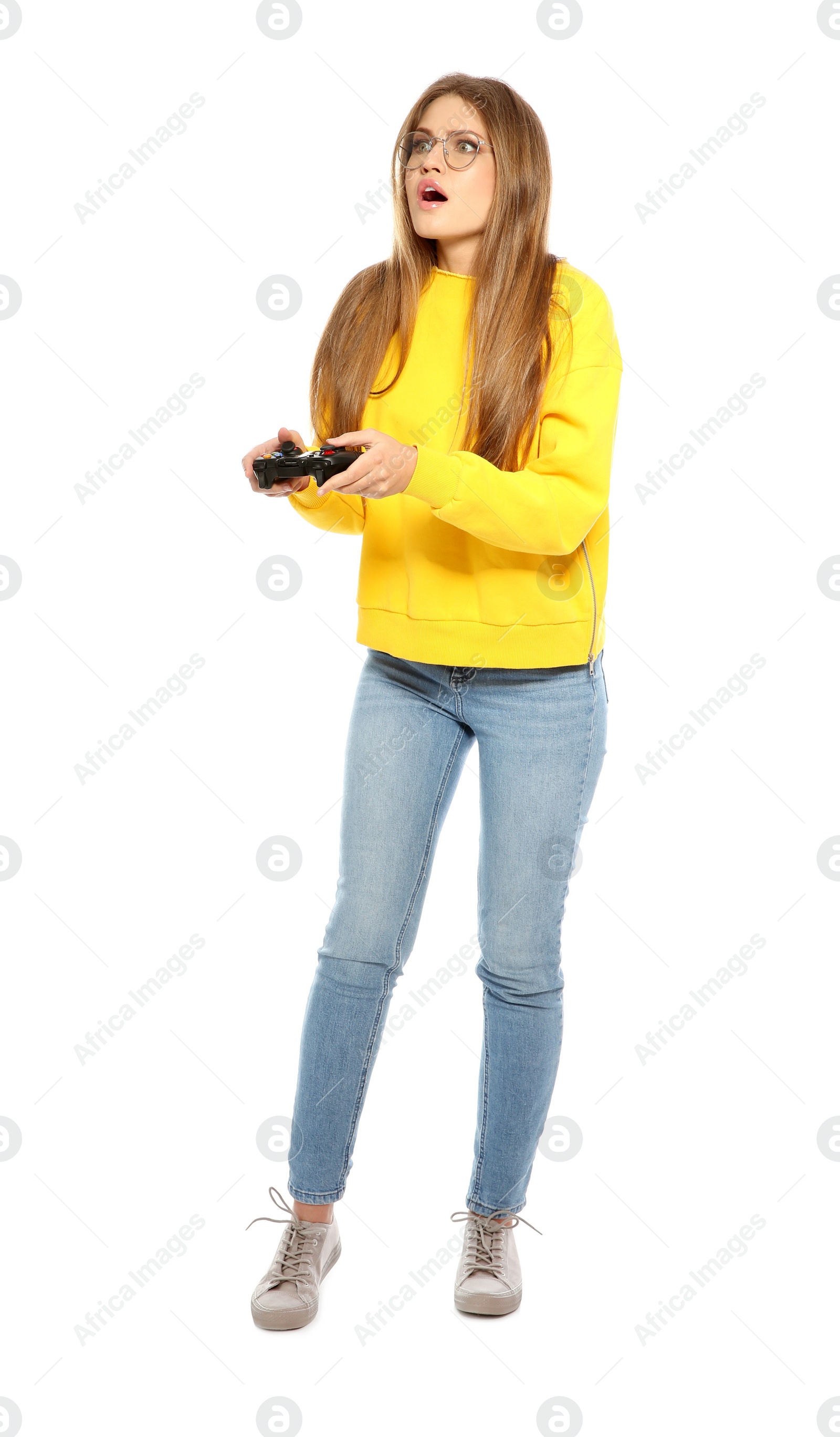 Photo of Emotional young woman playing video games with controller isolated on white