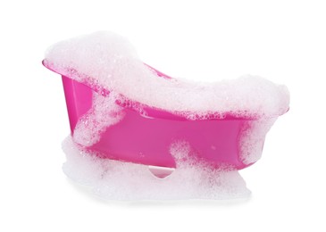 Photo of Pink toy bathtub with foam isolated on white