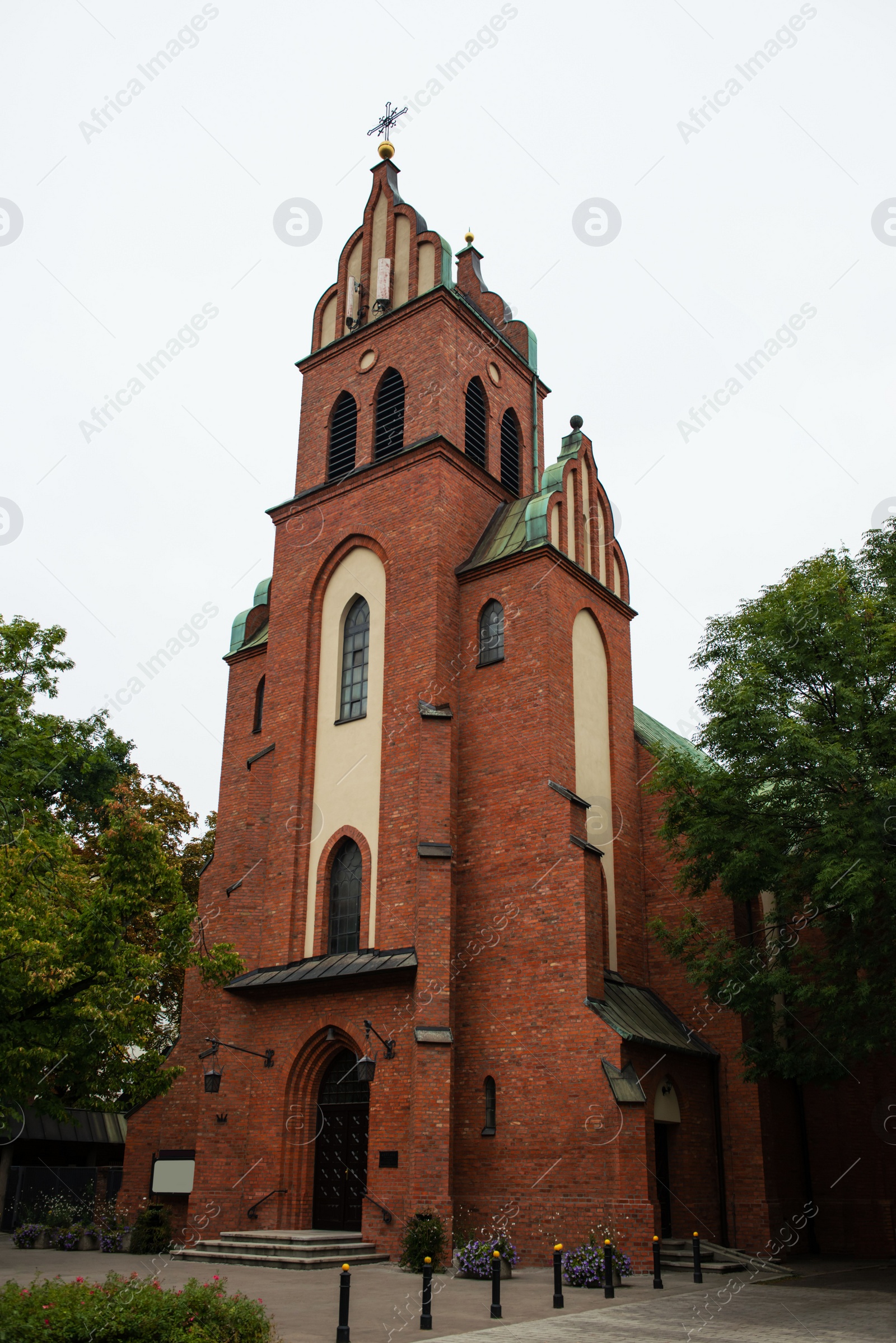 Photo of Beautiful view of church and plants under sky outdoors