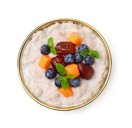 Photo of Delicious barley porridge with blueberries, pumpkin, dates and mint in bowl isolated on white, top view