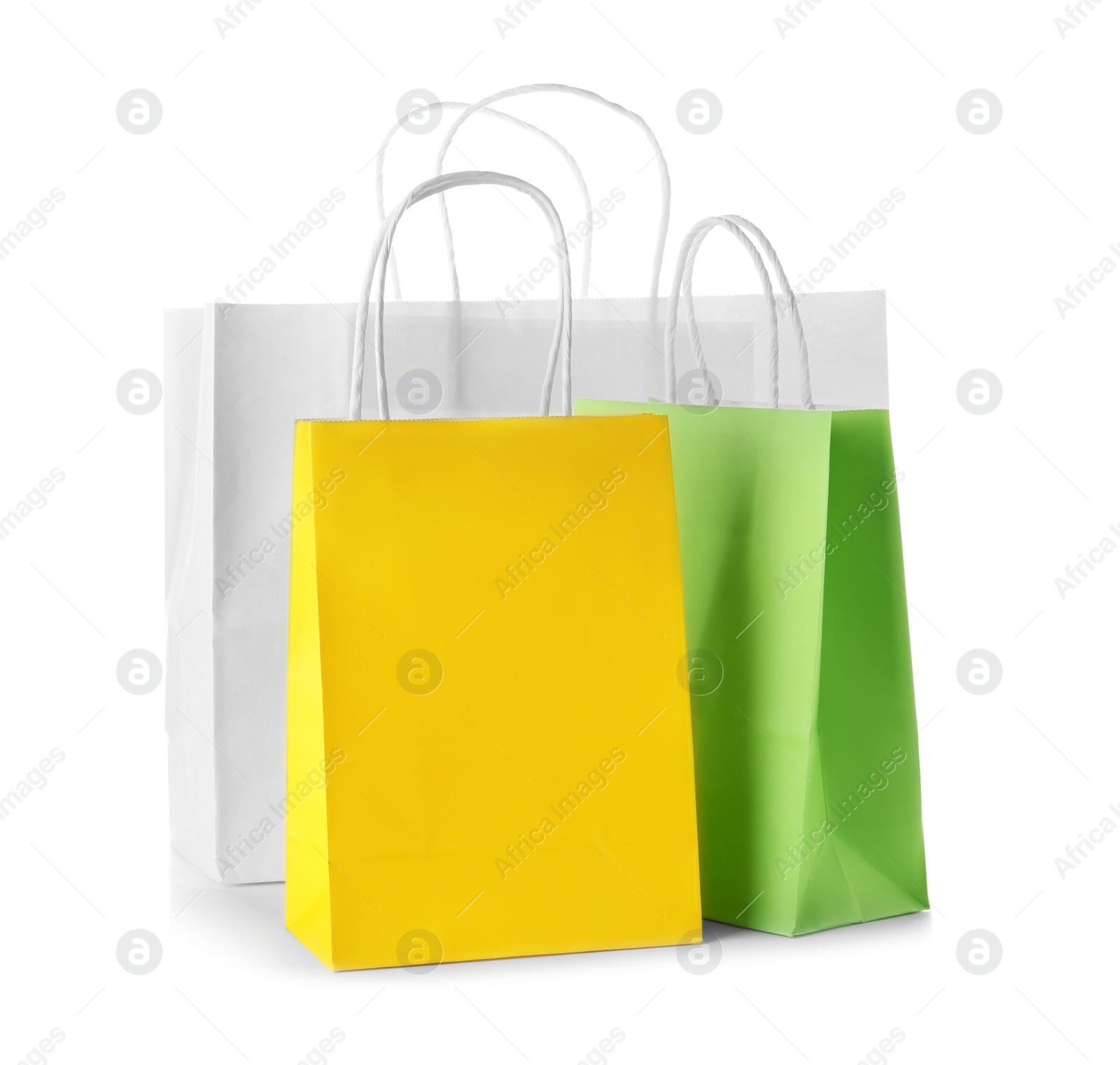 Photo of Mockup of paper shopping bags on white background