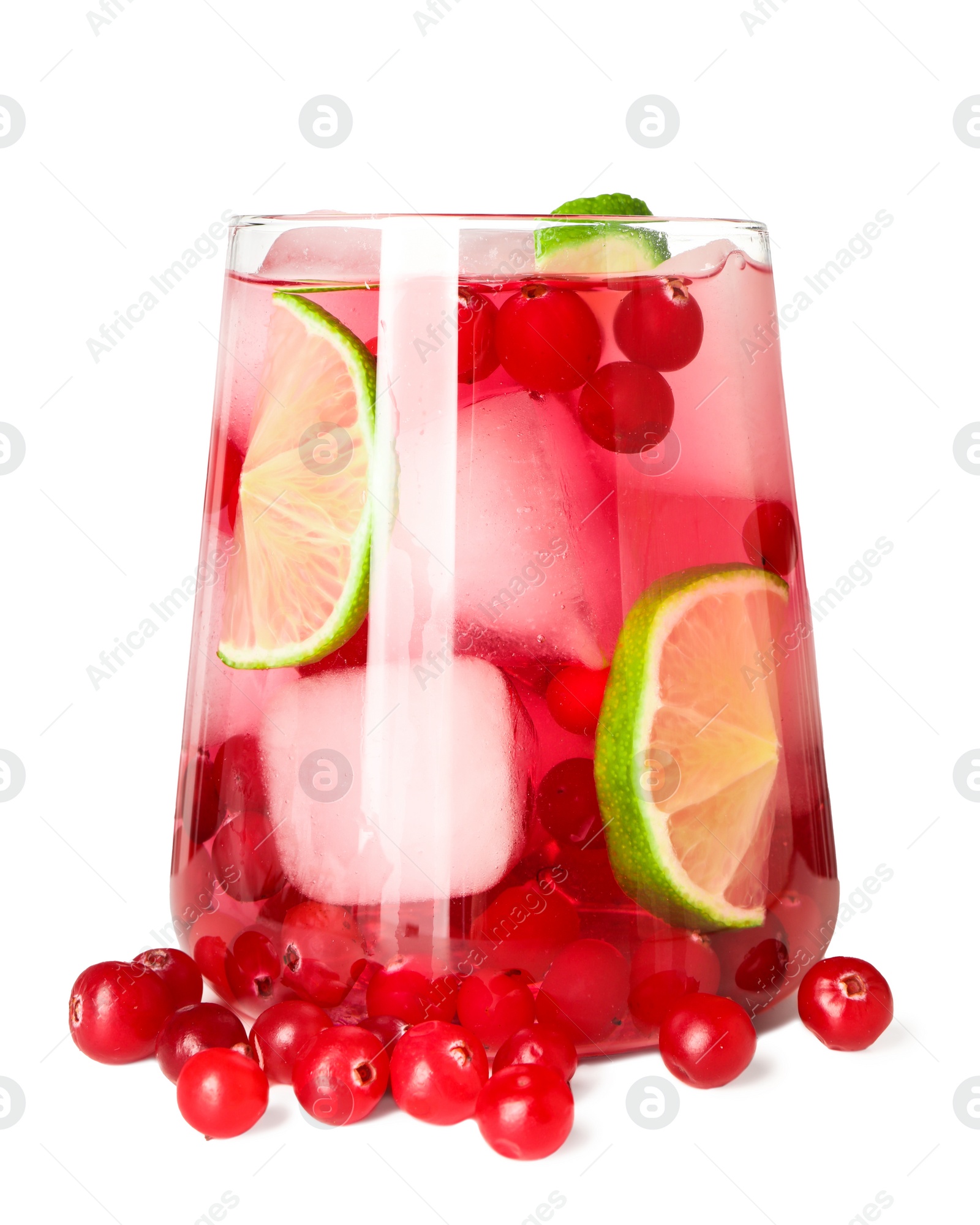 Photo of Tasty cranberry cocktail with ice cubes and lime in glass isolated on white