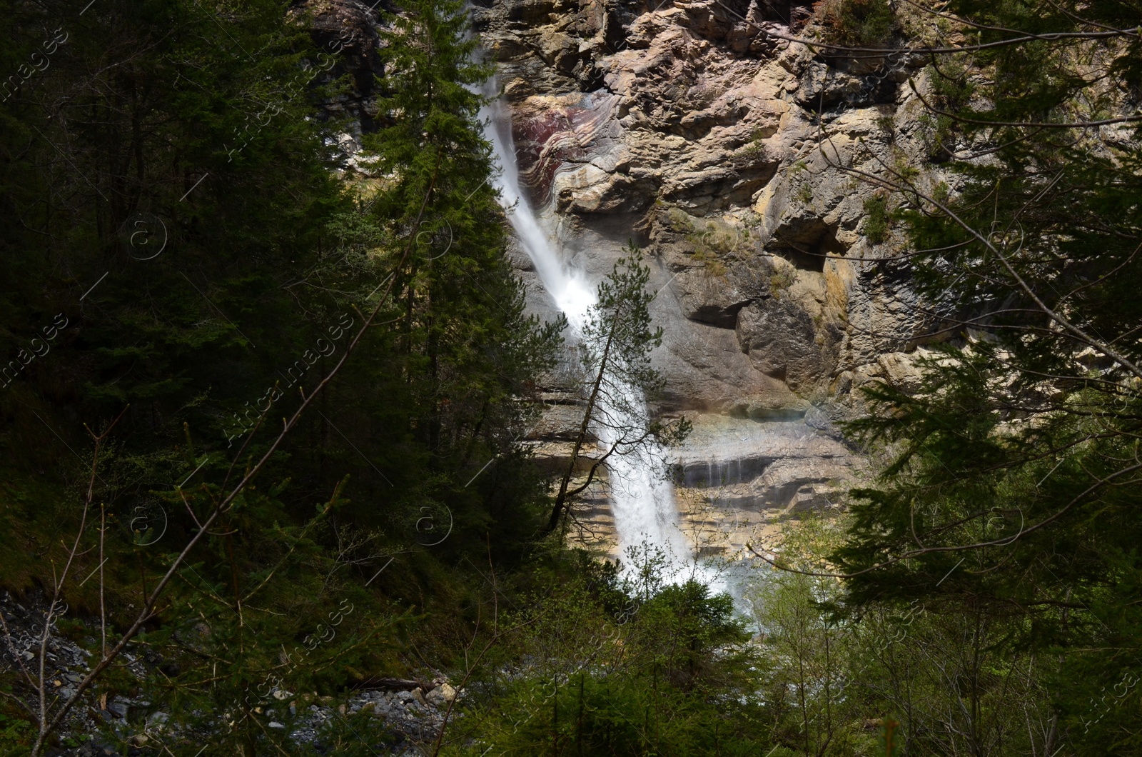 Photo of Picturesque view of beautiful mountain waterfall and rocks outdoors