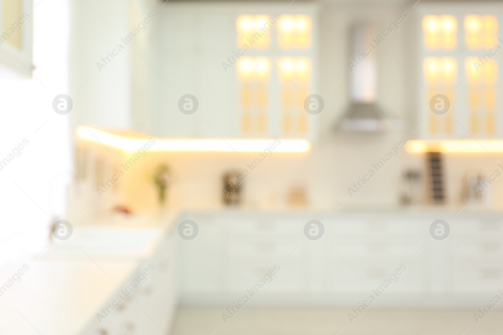 Photo of Blurred view of modern kitchen interior with stylish furniture