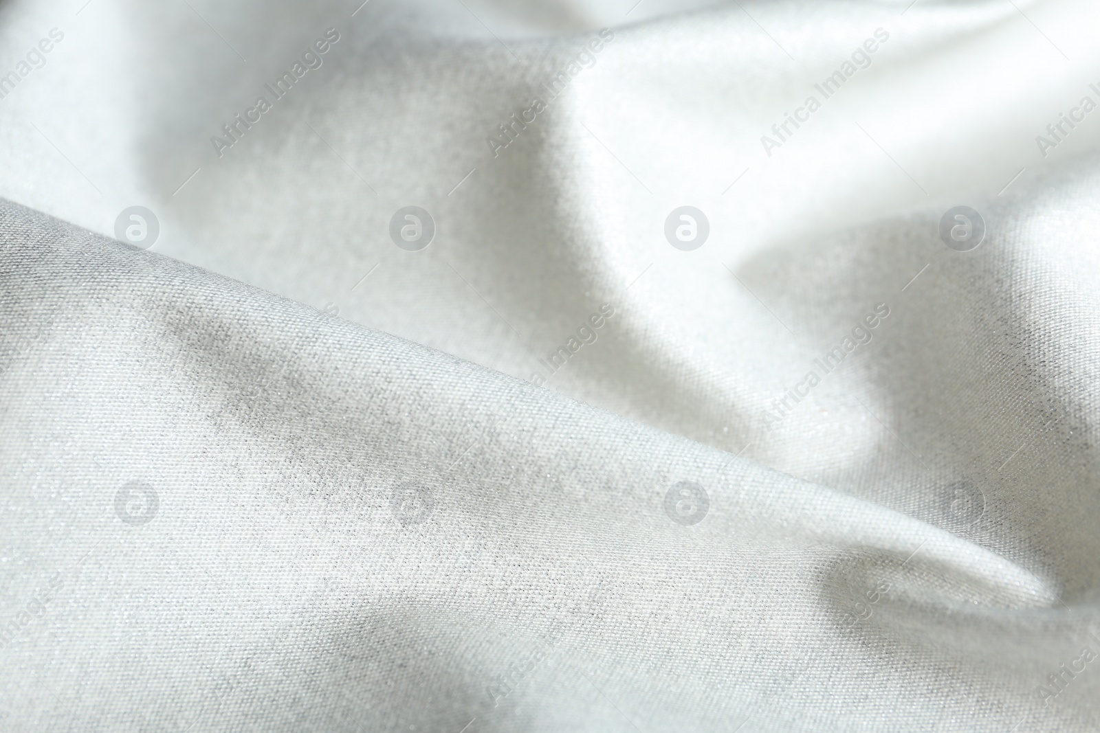 Photo of Texture of delicate white fabric as background, closeup