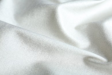 Texture of delicate white fabric as background, closeup