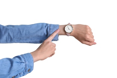 Photo of Young woman with wristwatch on white background. Time concept