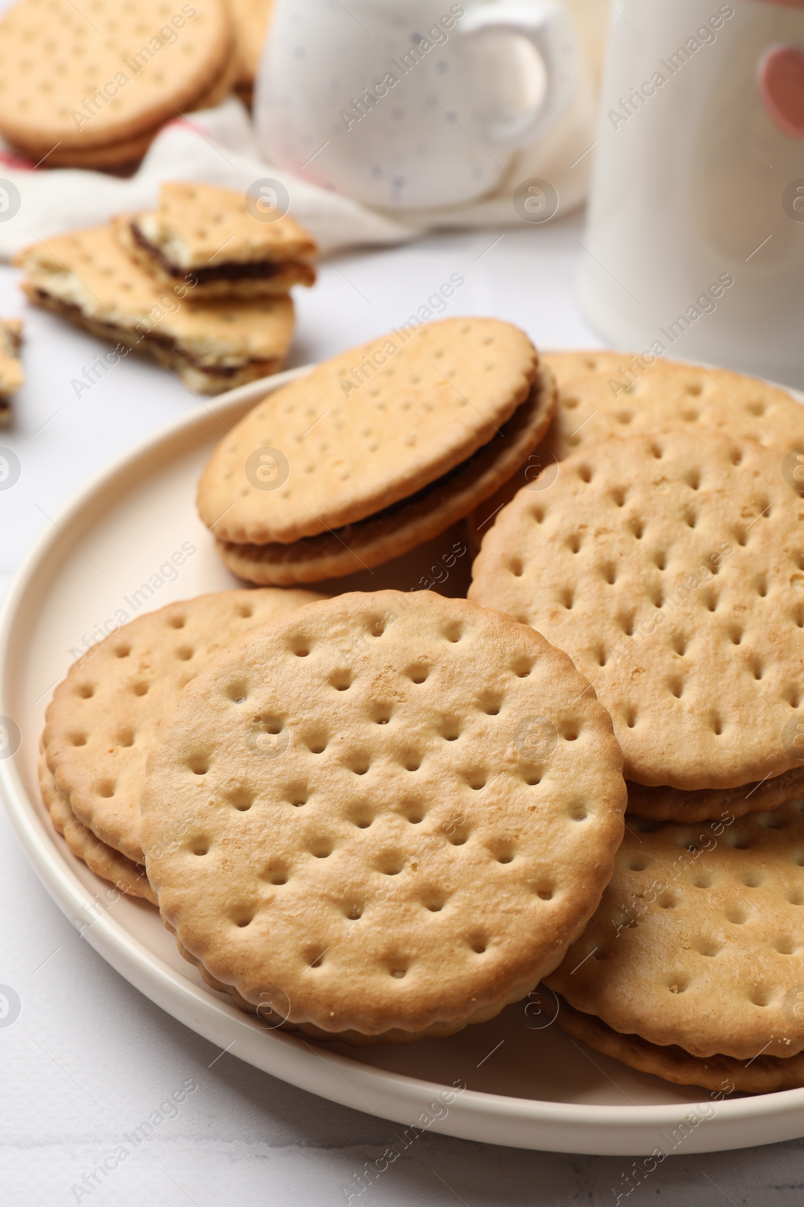 Photo of Tasty sandwich cookies on light table, closeup