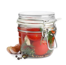 Photo of Pickled tomatoes in glass jar on white background
