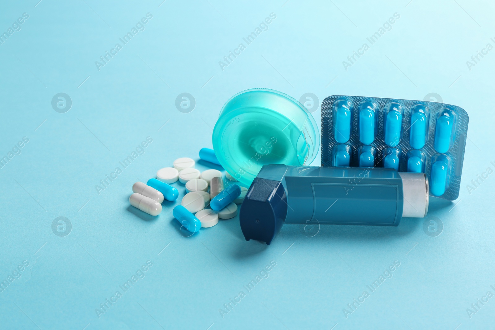 Photo of Set of asthma medications on color background