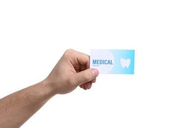 Photo of Man holding business card isolated on white, closeup. Dental medical service
