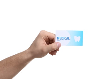 Man holding business card isolated on white, closeup. Dental medical service