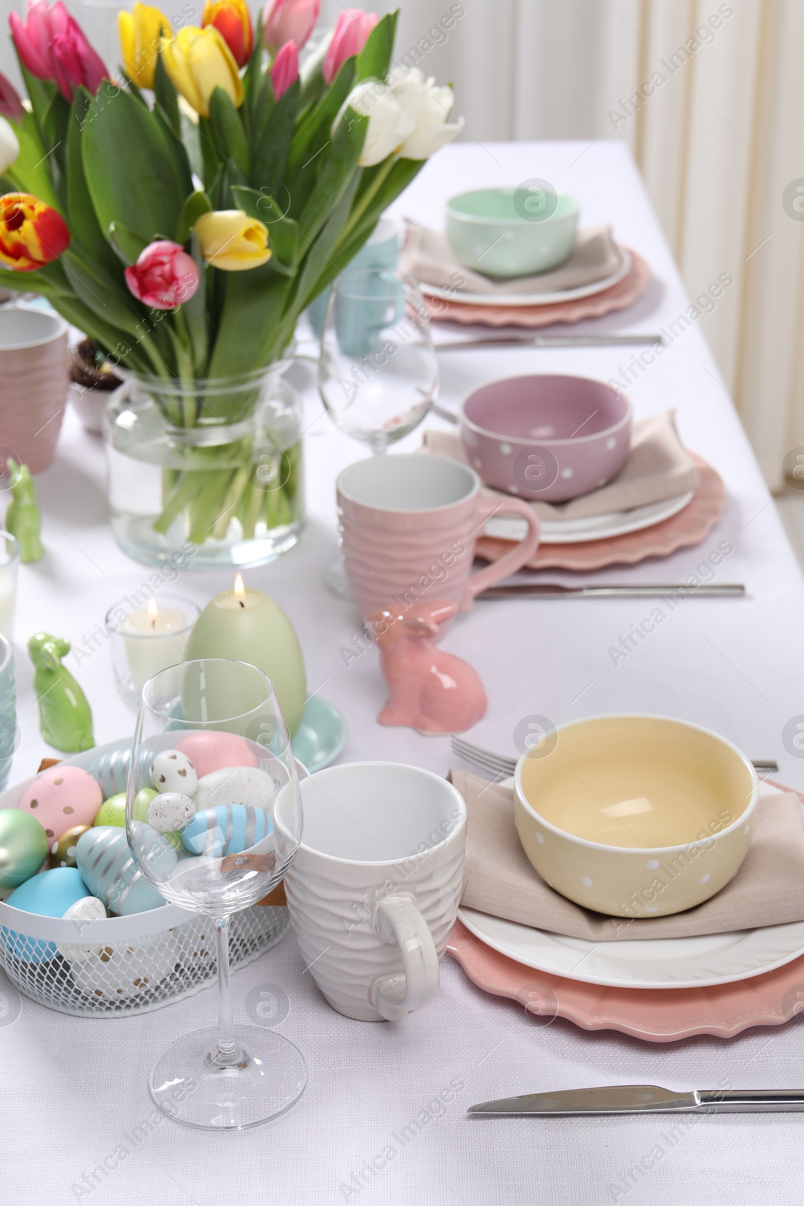 Photo of Festive table setting with beautiful flowers. Easter celebration