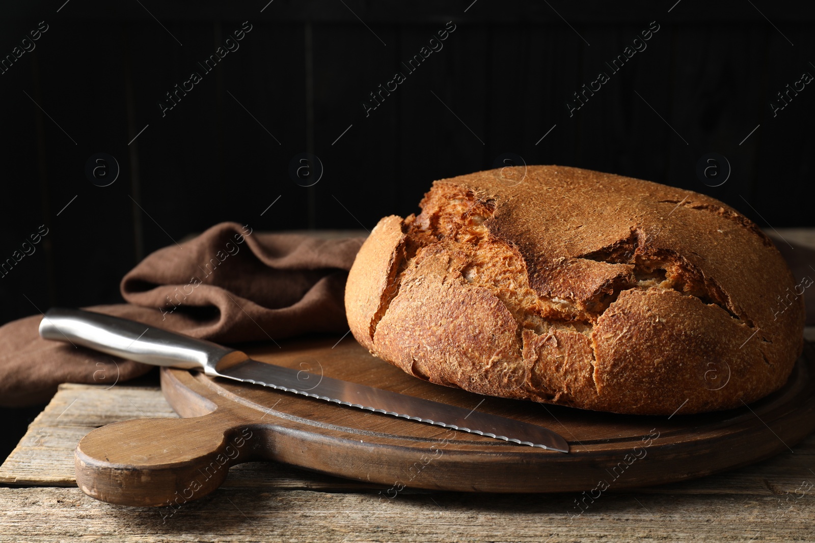 Photo of Freshly baked sourdough bread on wooden table