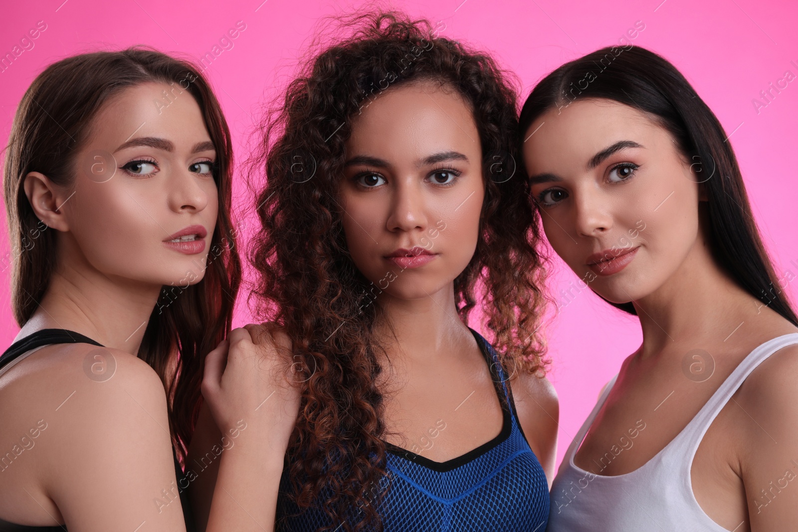 Photo of Portrait of beautiful women on pink background