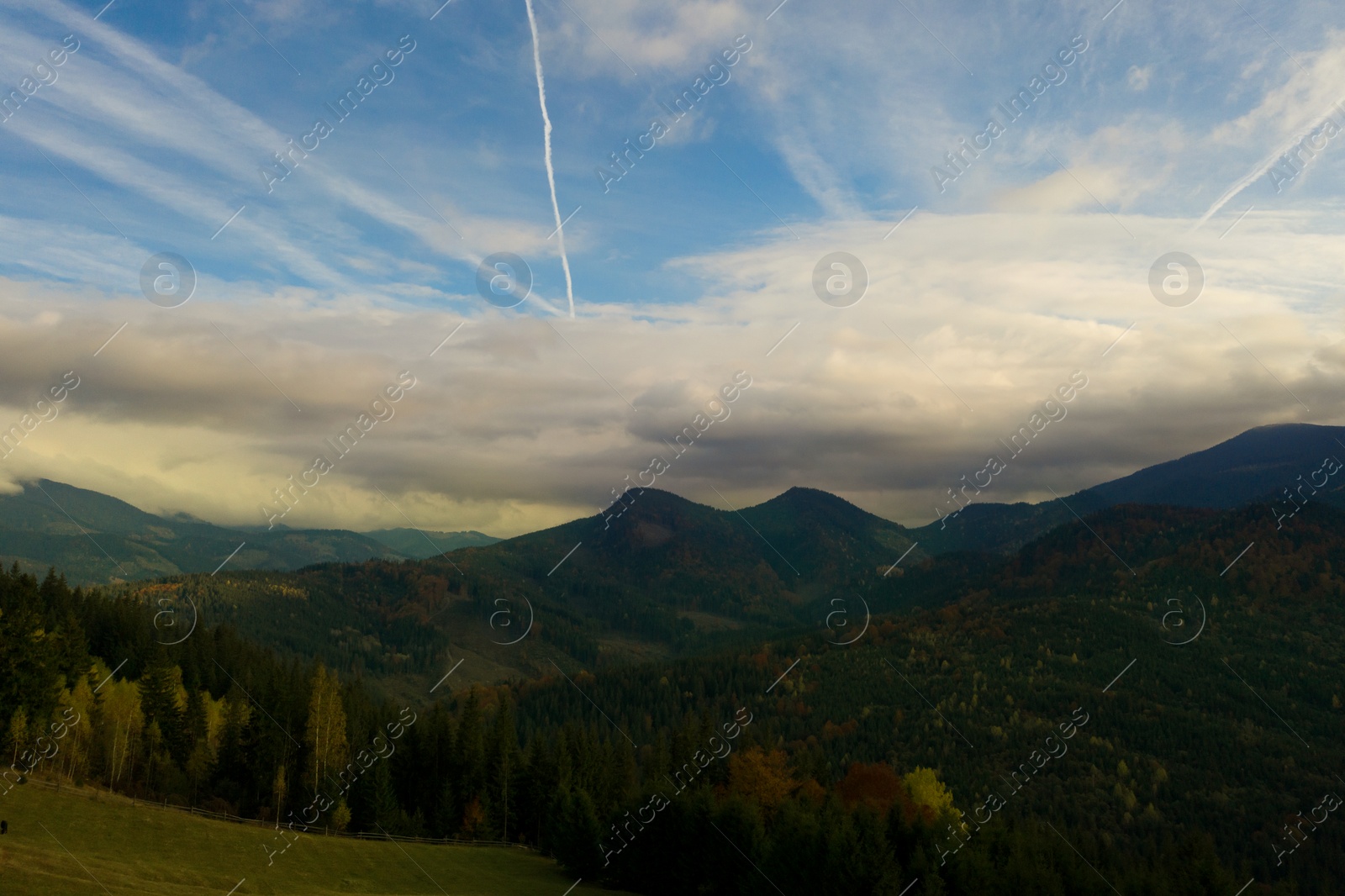 Image of Aerial view of beautiful mountain landscape with forest on sunny day