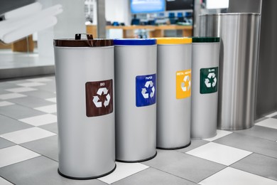 Different recycling bins for trash in shopping mall