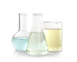 Photo of Laboratory glassware with liquid on white background. Chemical analysis