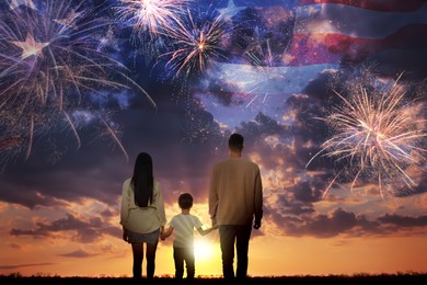 Image of 4th of July - Independence day of America. Family enjoying fireworks in sky. Double exposure with flag of United States