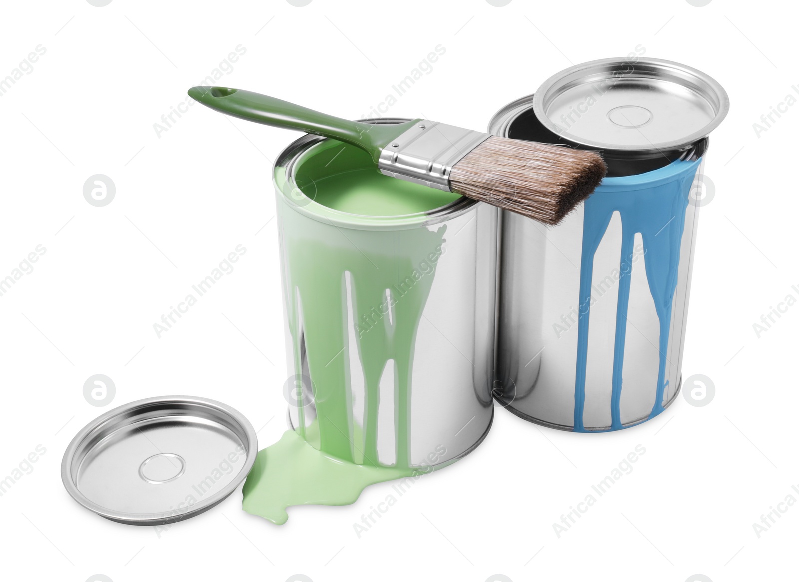 Photo of Cans of green and light blue paints and brush isolated on white