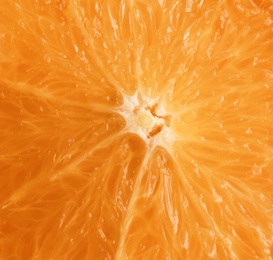 Tasty fresh cut orange as background, closeup
