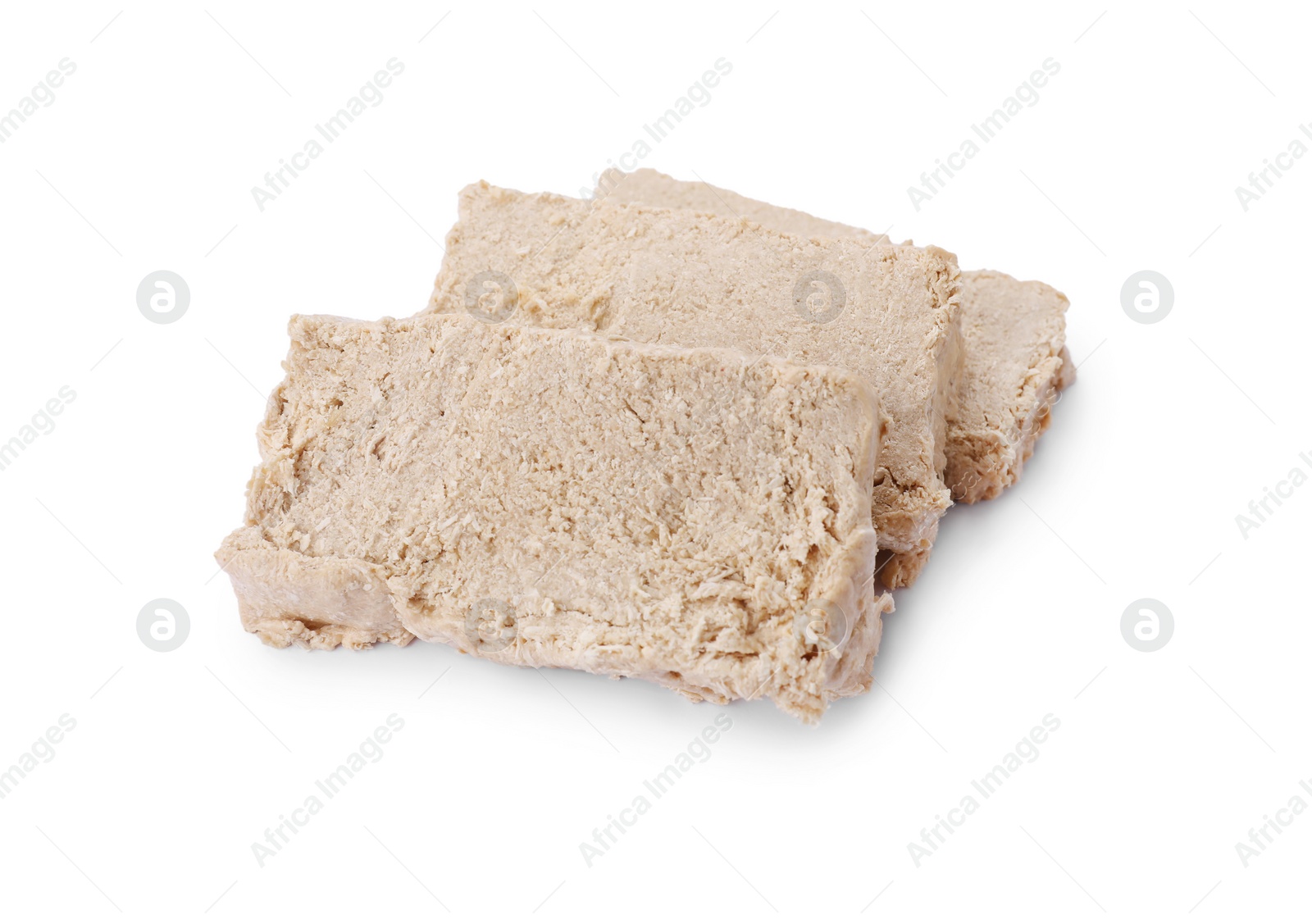 Photo of Pieces of tasty halva isolated on white