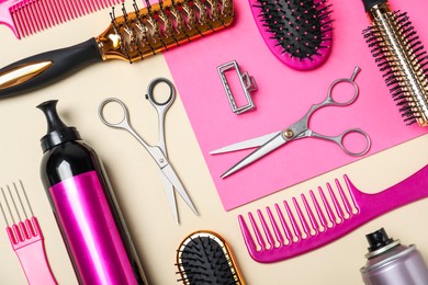 Photo of Flat lay composition of professional scissors and other hairdresser's equipment on color background. Haircut tool