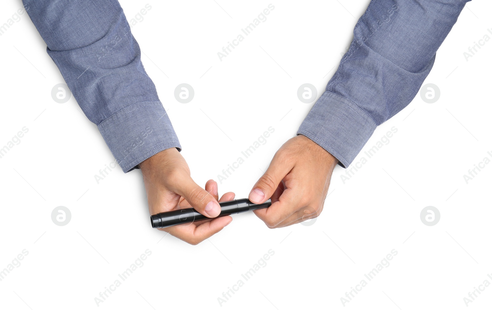 Photo of Man with marker on white background, top view. Closeup of hands