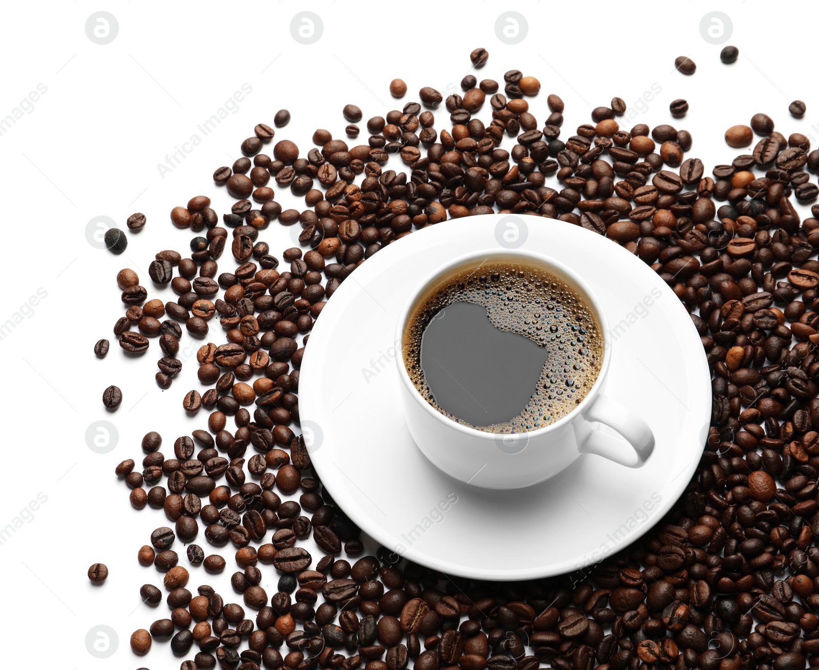 Photo of Roasted coffee beans and cup of hot beverage on white background